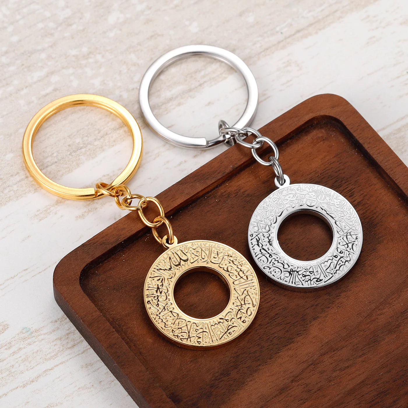 Ayatul Kursi keychain in gold and silver with engraved Arabic verse