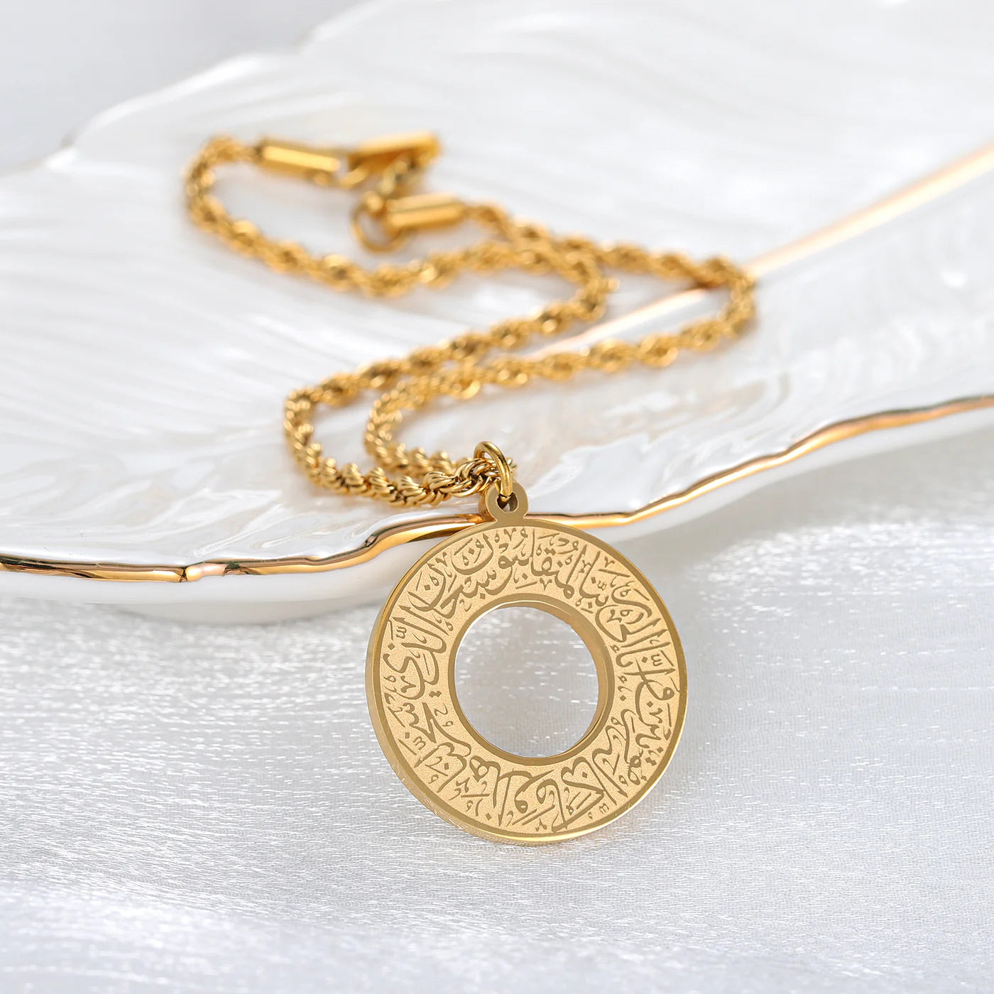 Dua Al-Safar gold car hanger with engraved Arabic prayer